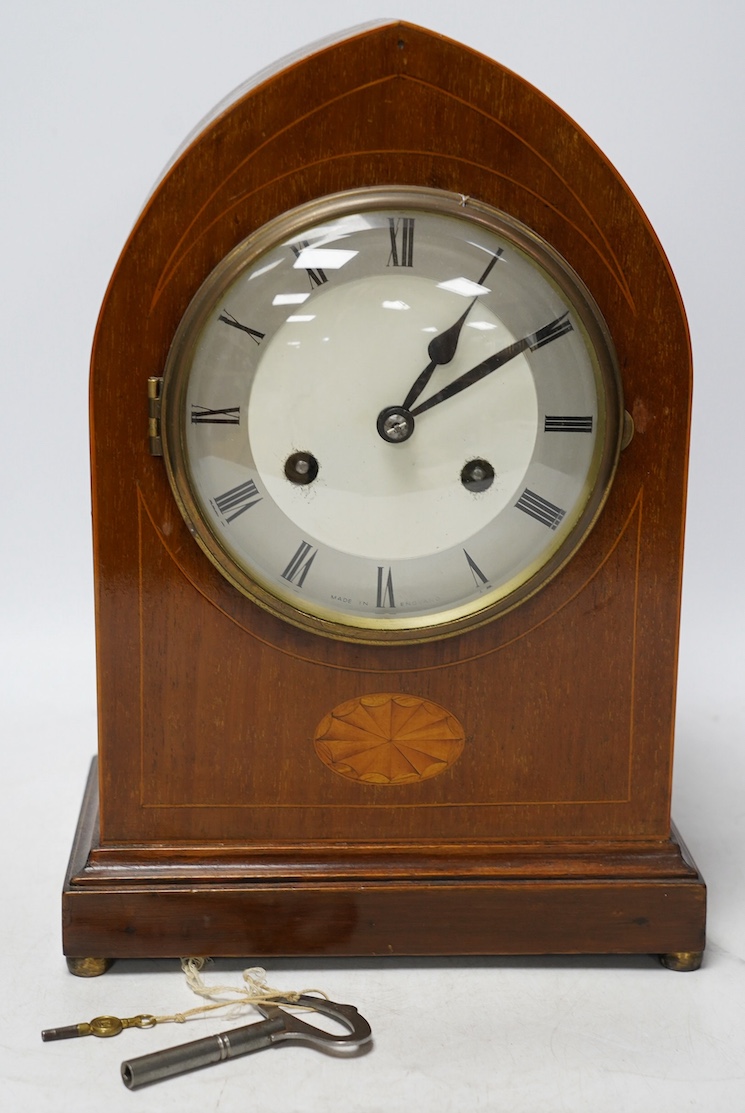 An Edwardian inlaid mahogany eight day lancet topped mantel clock, with key, 31cm high. Condition - fair, untested